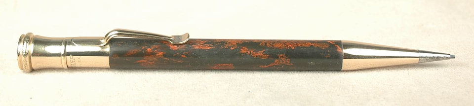 Antique gold mechanical pencil, copper accents.