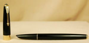 Black fountain pen with gold accents.