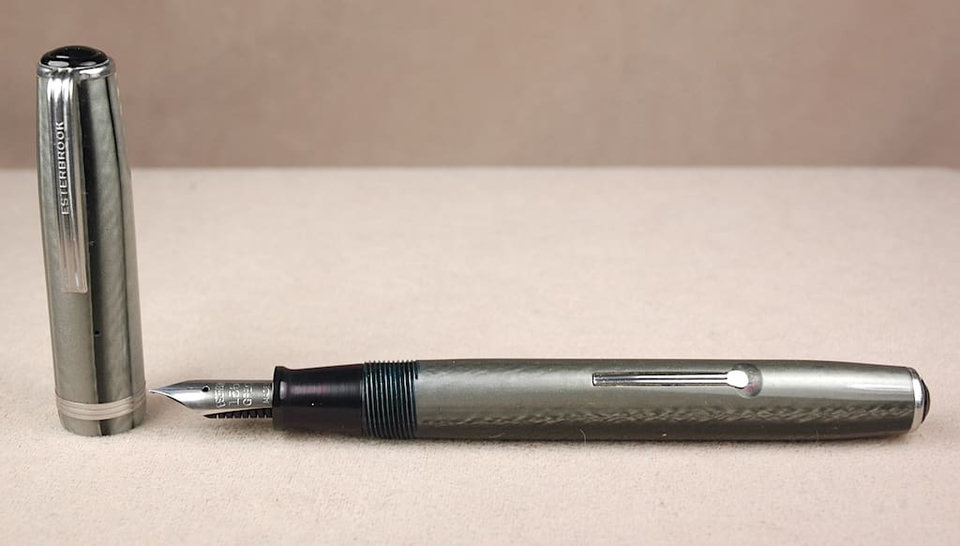 Silver fountain pen with detachable cap.