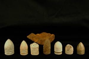 Six vintage bullets on black background.