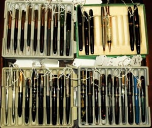 Collection of vintage fountain pens in boxes.