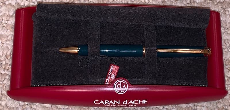 Caran d'Ache pen in red box.