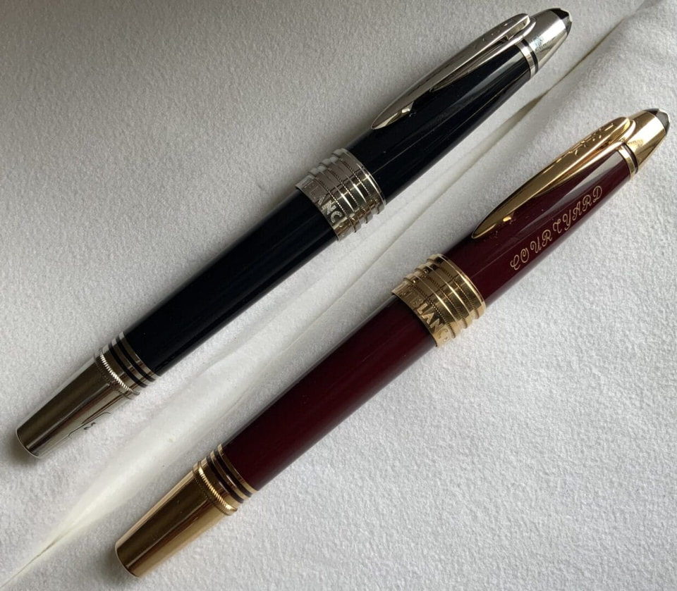 Two luxury pens on a white surface.